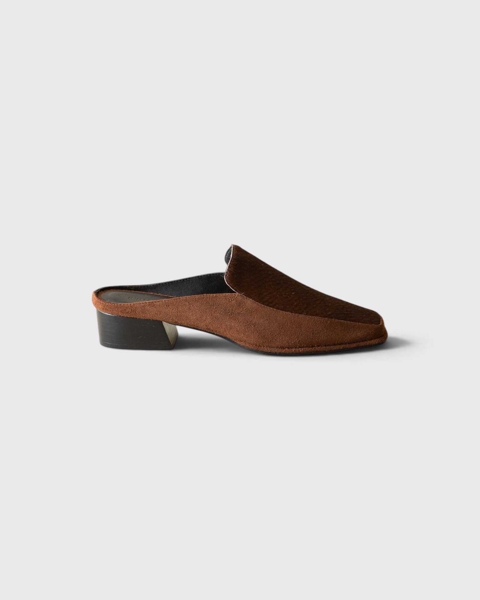 JONES + CO Felix loafer mule in chocolate calf hair with a square toe and sculpted leather-wrapped wood heel.