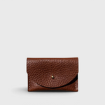 JONES + CO chocolate brown pebbled leather cardholder with a solid brass fastener, front view.