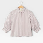 JONES + CO Esme Blouse in cinnamon stripe Spanish cotton poplin. Features lined puff sleeves, button-front, and pearl buttons.