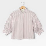 JONES + CO Esme Blouse in cinnamon stripe Spanish cotton poplin. Features lined puff sleeves, button-front, and pearl buttons.