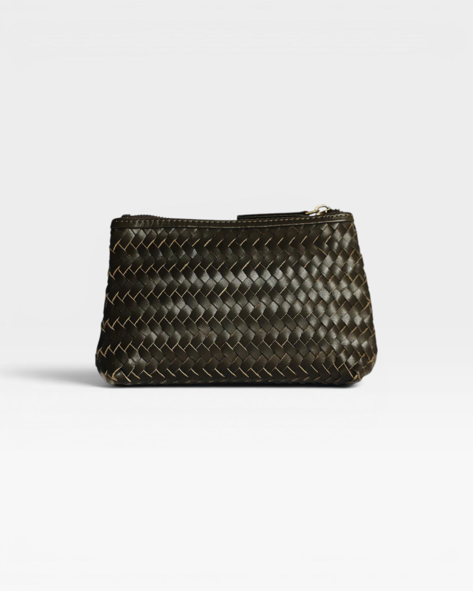 JONES + CO Cleo Pouch, a small zip pouch in handwoven dark green leather for organizing essentials.