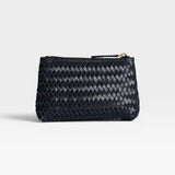 JONES + CO Cleo Pouch: small dark navy woven leather zip pouch for organizing essentials.