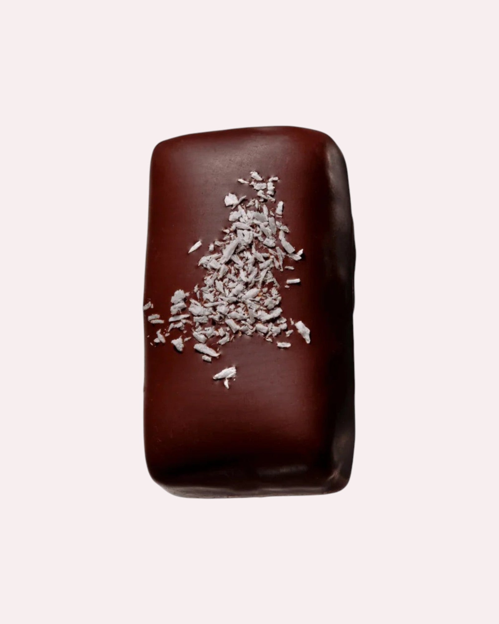 JONES + CO dark chocolate bar with coconut and cashew, topped with shredded coconut flakes.