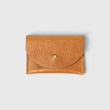 JONES + CO cognac leather cardholder with a pebbled texture and a simple brass stud closure.