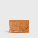 JONES + CO cognac leather cardholder with a pebbled texture and a simple brass stud closure.