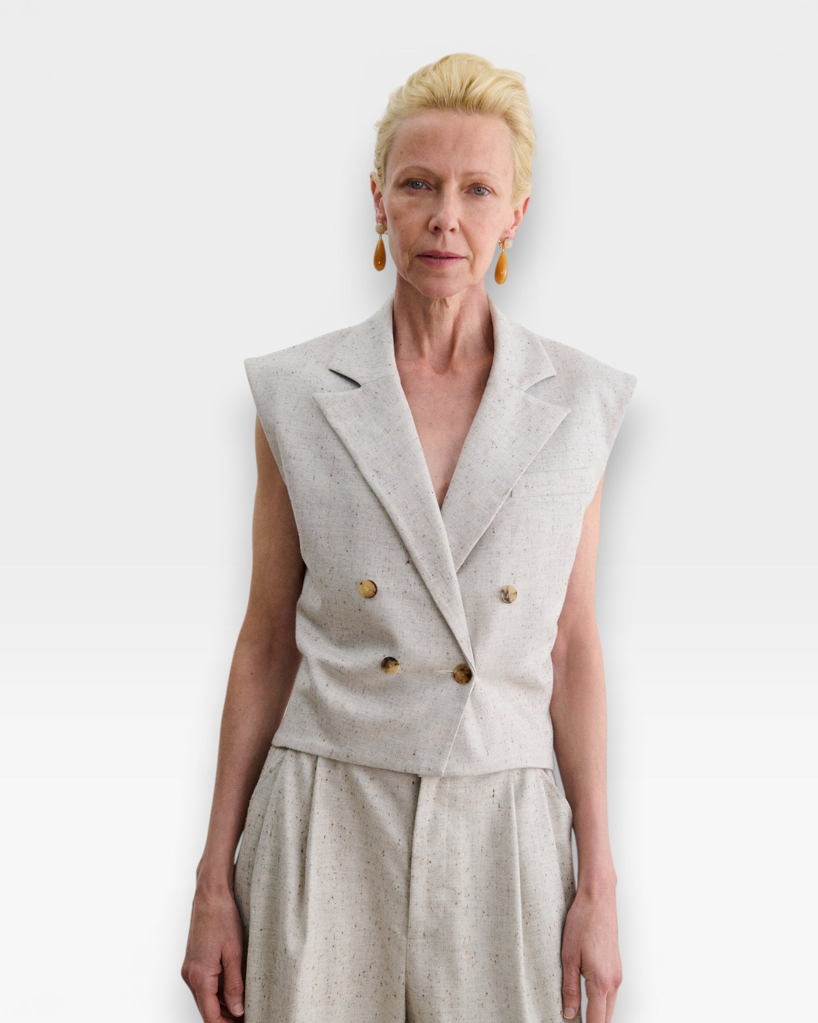 JONES + CO Comeau double-breasted grey speckled suiting vest with peak lapels and horn-look buttons on a model