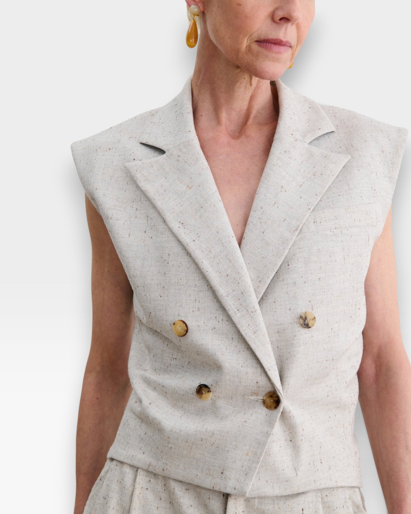 JONES + CO Comeau double-breasted grey speckled suiting vest with peak lapels and horn-look buttons.