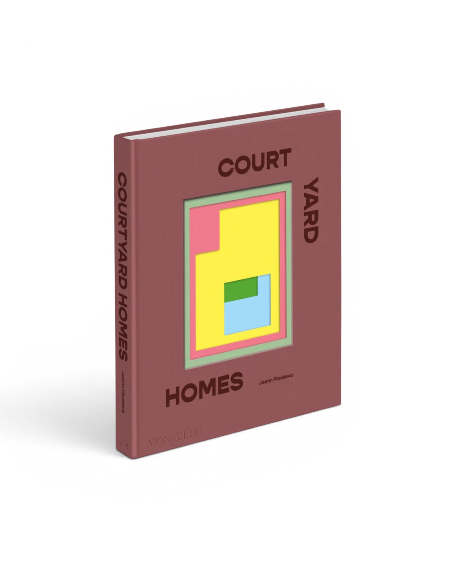 JONES + CO Courtyard Homes hardcover book with a dusty rose cover and abstract geometric design