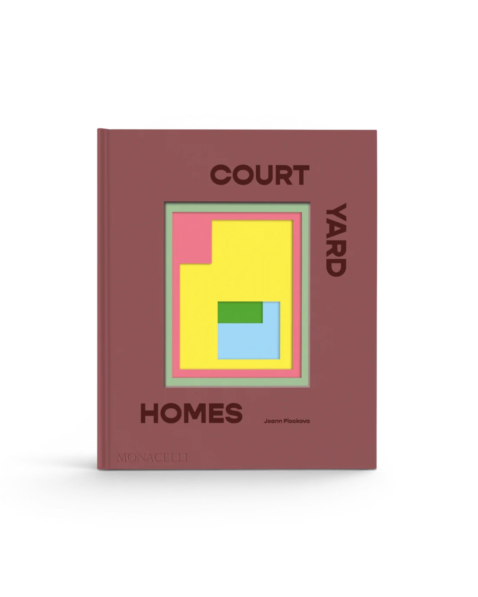JONES + CO Courtyard Homes hardcover book featuring a minimalist geometric cover design in muted red, yellow, and blue.