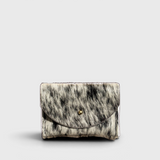 JONES + CO salt and pepper cowhide cardholder with a solid brass fastener, shown from a front view.