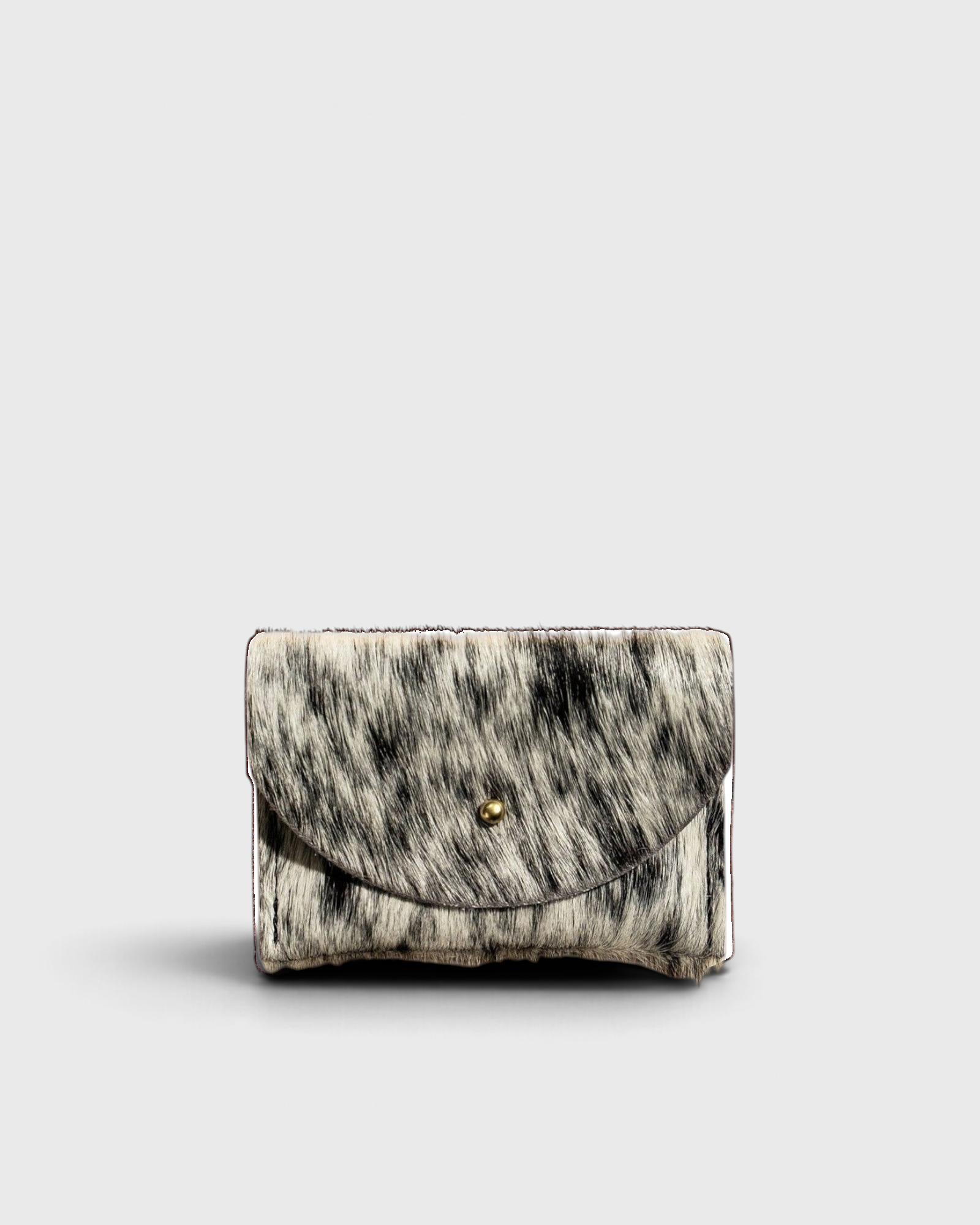 JONES + CO salt and pepper cowhide cardholder with a solid brass fastener, shown from a front view.