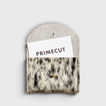 JONES + CO salt and pepper cowhide cardholder with a gold snap closure on a neutral background