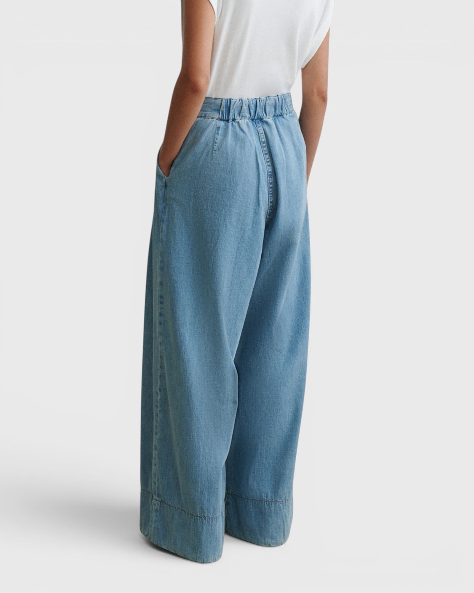 JONES + CO Coxsone wide-leg pleated trousers in celeste blue organic cotton with an elasticated back waistband.