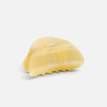 JONES + CO crescent-shaped hair claw clip in a translucent citrine yellow finish with a simple hold design