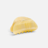 JONES + CO crescent-shaped hair claw clip in a translucent citrine yellow finish with a simple hold design