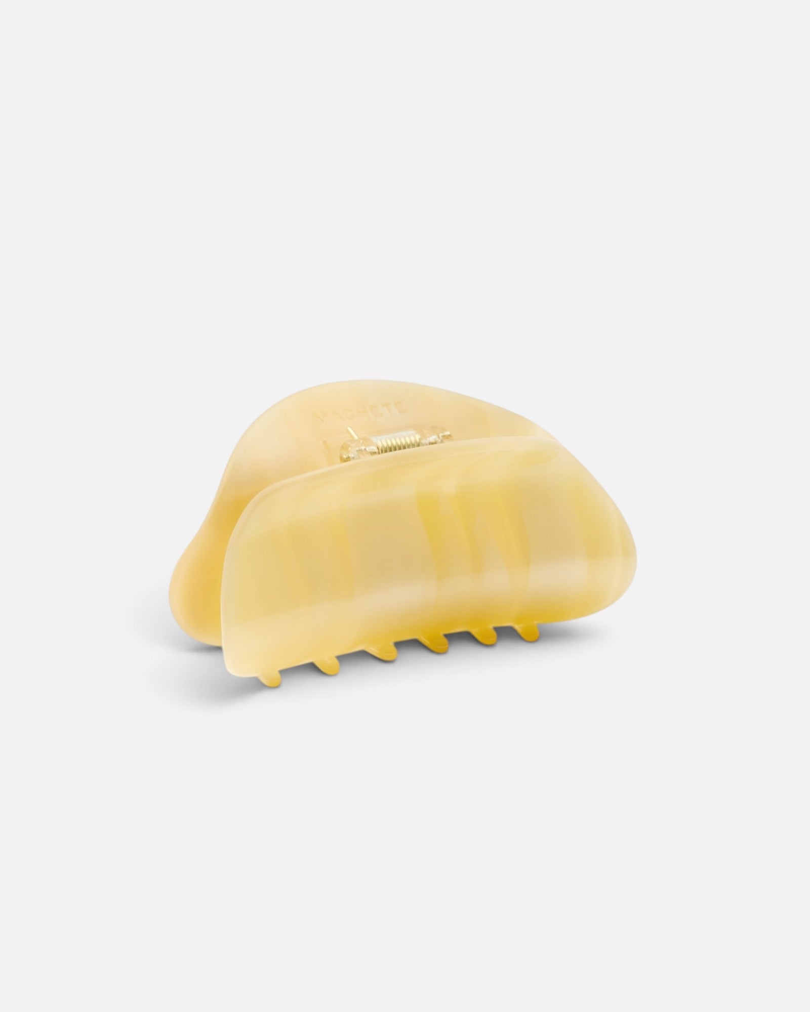 JONES + CO crescent-shaped hair claw clip in a translucent citrine yellow finish with a simple hold design