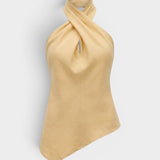 JONES + CO Maria Top in daffodil yellow linen with a halter neck, twisted front detail, and asymmetrical hemline.