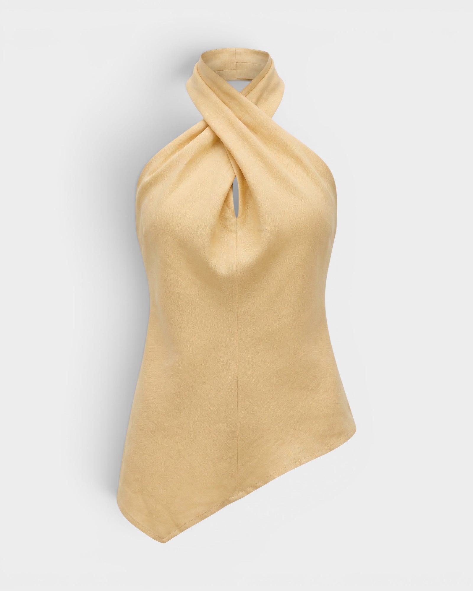 JONES + CO Maria Top in daffodil yellow linen with a halter neck, twisted front detail, and asymmetrical hemline.
