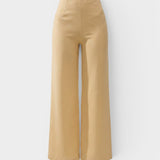 JONES + CO Syna high-rise wide leg pants in daffodil yellow linen with a smooth fitted waist and cropped length
