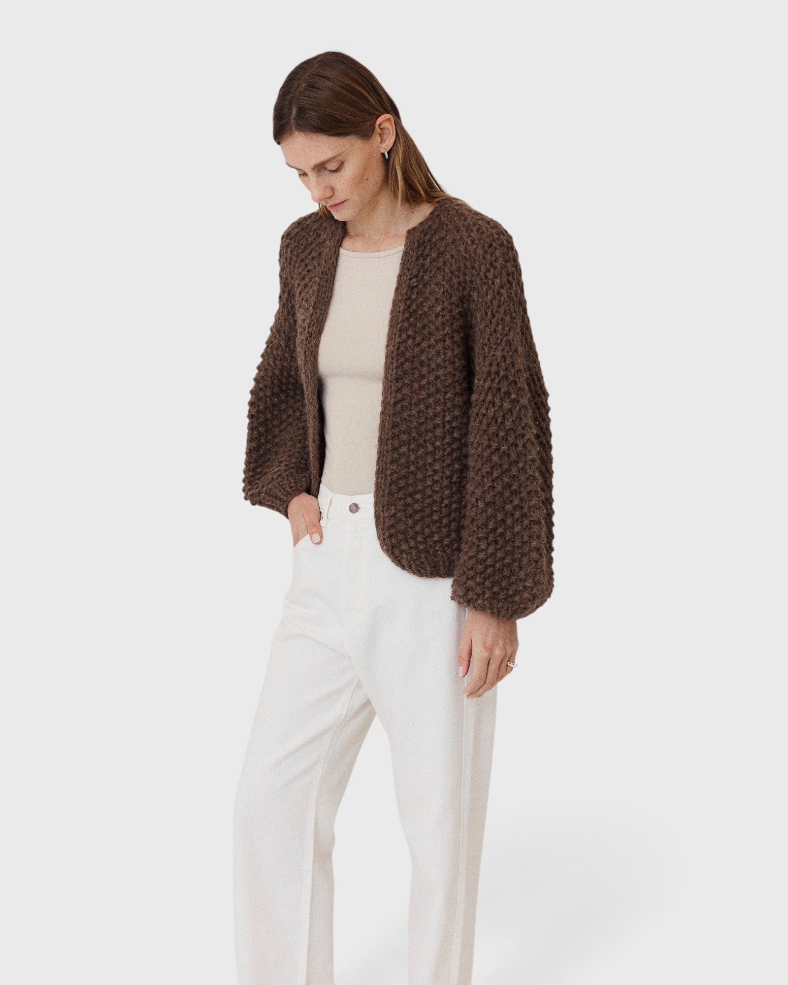 JONES + CO dark brown chunky alpaca bomber cardigan with a textured pearl knit pattern worn by a woman