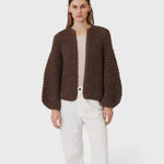 JONES + CO dark brown chunky alpaca bomber cardigan with a textured pearl knit pattern worn by a model.