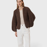 JONES + CO dark brown chunky alpaca bomber cardigan with a textured pearl knit pattern worn by a model