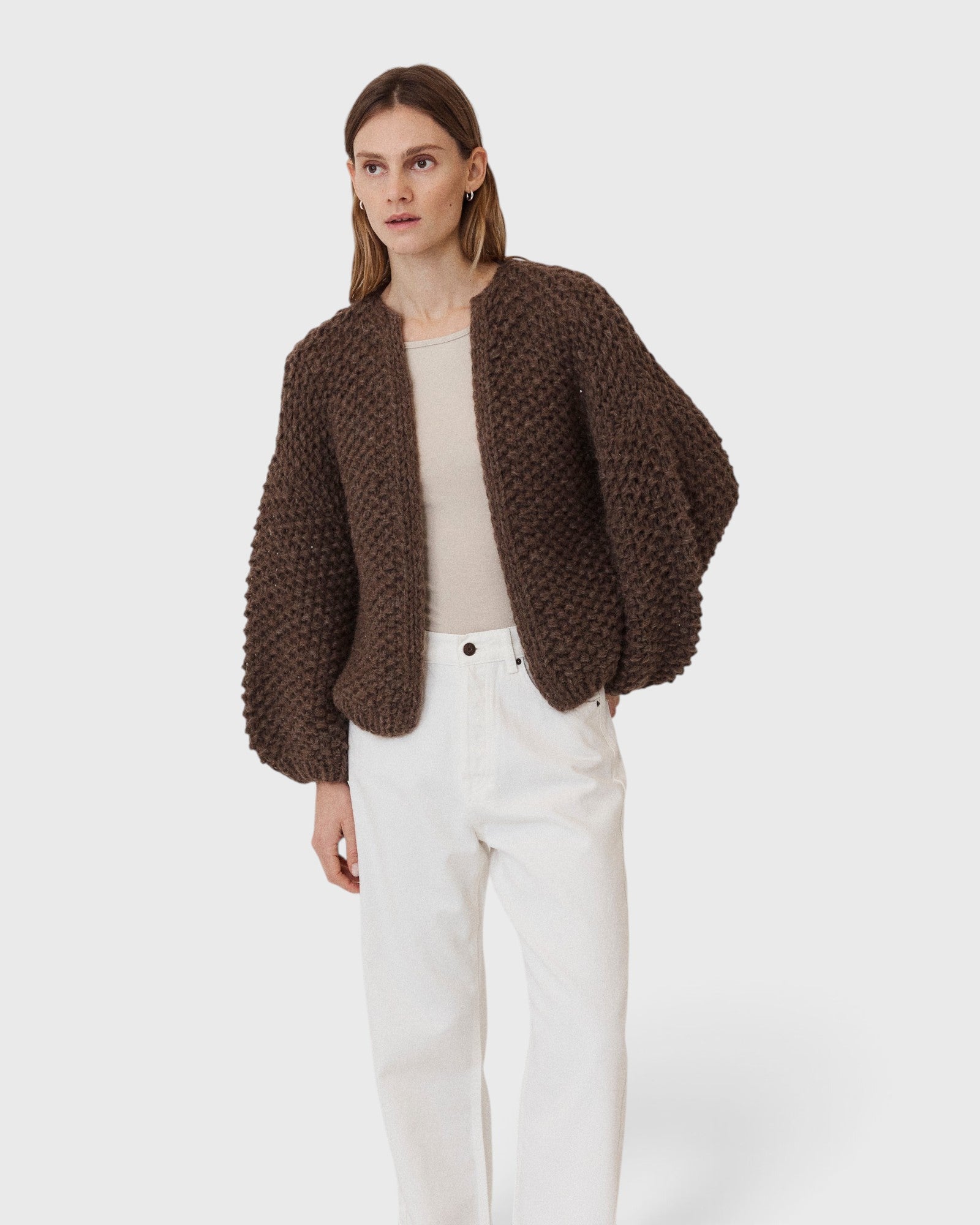 JONES + CO dark brown chunky alpaca bomber cardigan with a textured pearl knit pattern worn by a model