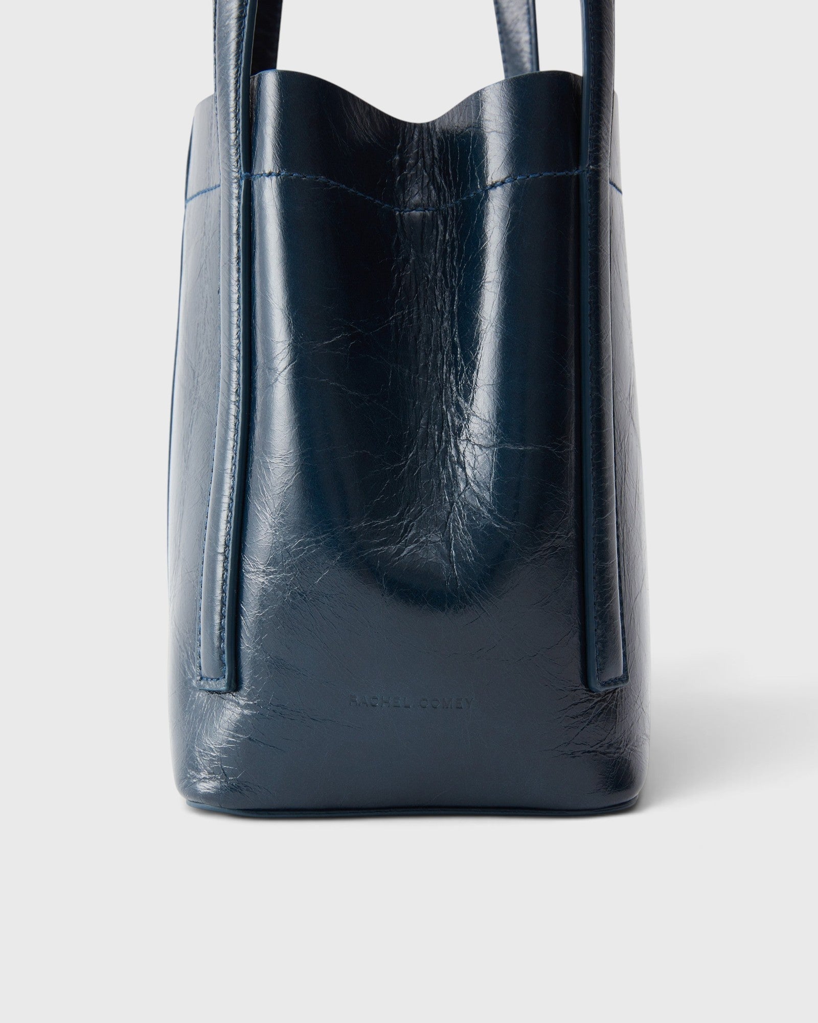JONES + CO Bucket Tool bag in dark indigo lustre leather with vertical paneling and sturdy elongated handles