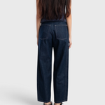 JONES + CO dark indigo high-rise relaxed-fit jeans with outseam piecing and rounded leg shape, back view