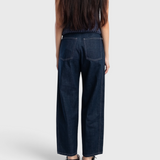 JONES + CO dark indigo high-rise relaxed-fit jeans with outseam piecing and rounded leg shape, back view