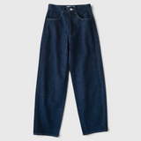 JONES + CO dark indigo high-rise relaxed-fit jeans with outseam piecing and a rounded leg silhouette.