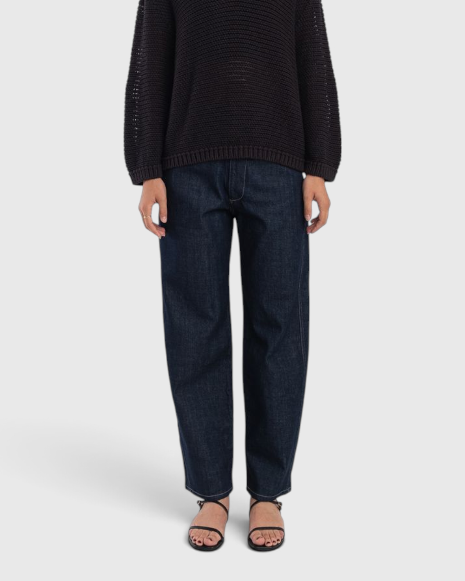 JONES + CO dark indigo high-rise relaxed-fit jeans with outseam piecing and a rounded leg silhouette