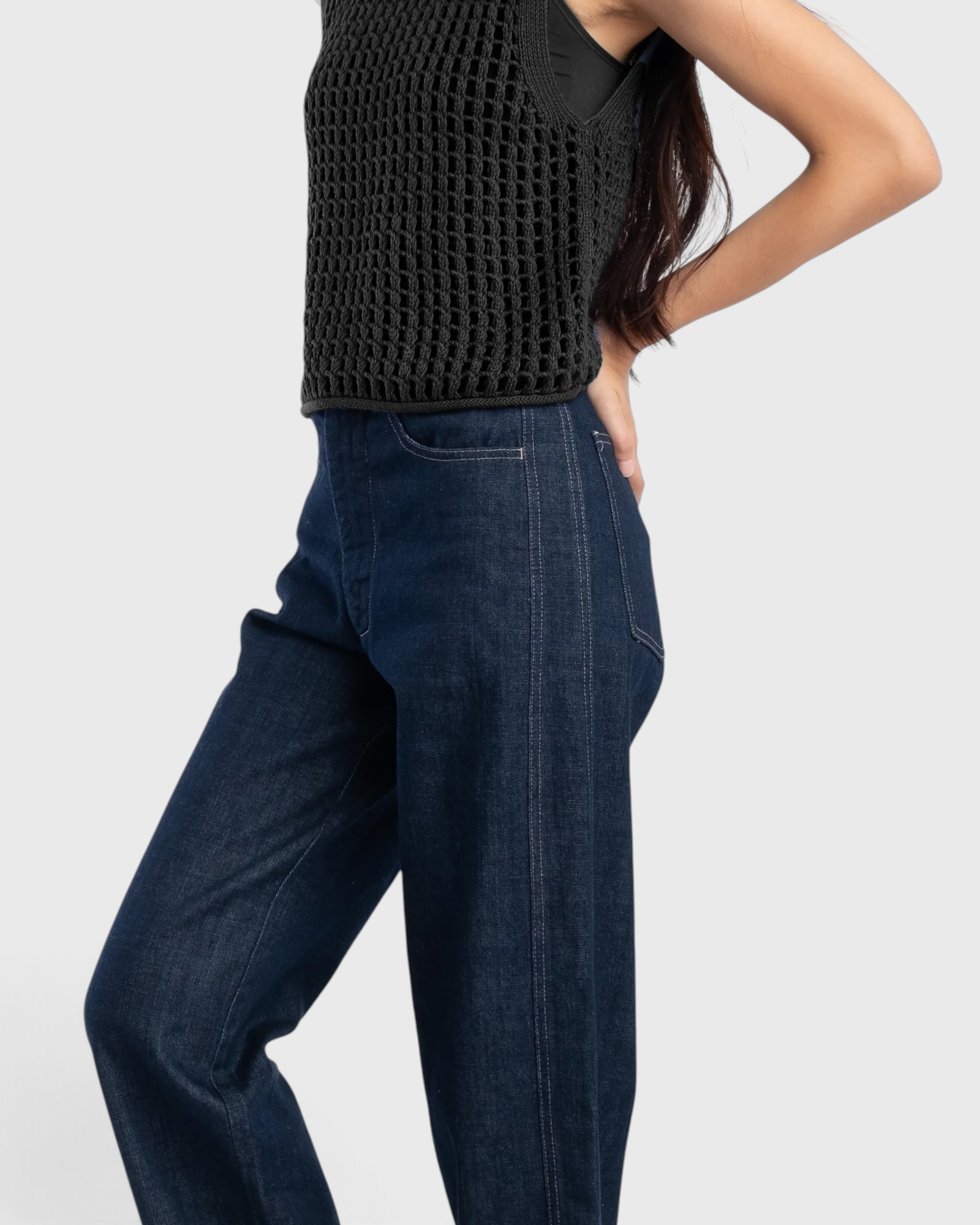 JONES + CO dark indigo high-rise relaxed-fit jeans with outseam piecing and a rounded leg silhouette