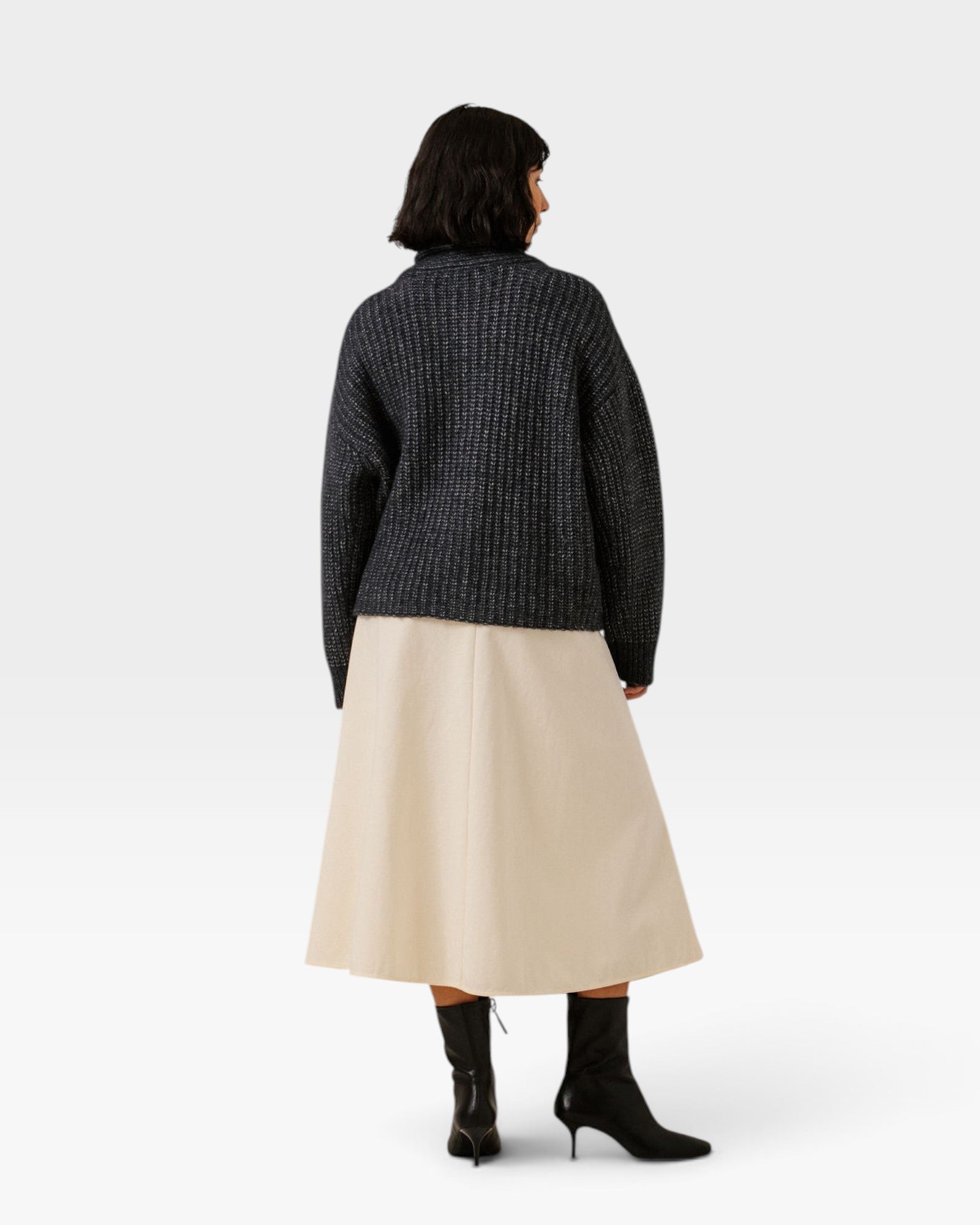 JONES + CO dark navy oversized shawl cardigan in alpaca and cotton blend, worn with a beige skirt and black boots.
