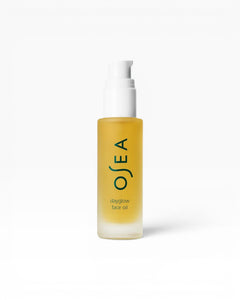 JONES + CO Dayglow Face Oil in a frosted glass bottle with a white pump. Seaweed-infused formula for a dewy finish.