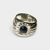 JONES + CO Dean ring in .925 sterling silver featuring a bold, sculptural design with a blue star sapphire center.