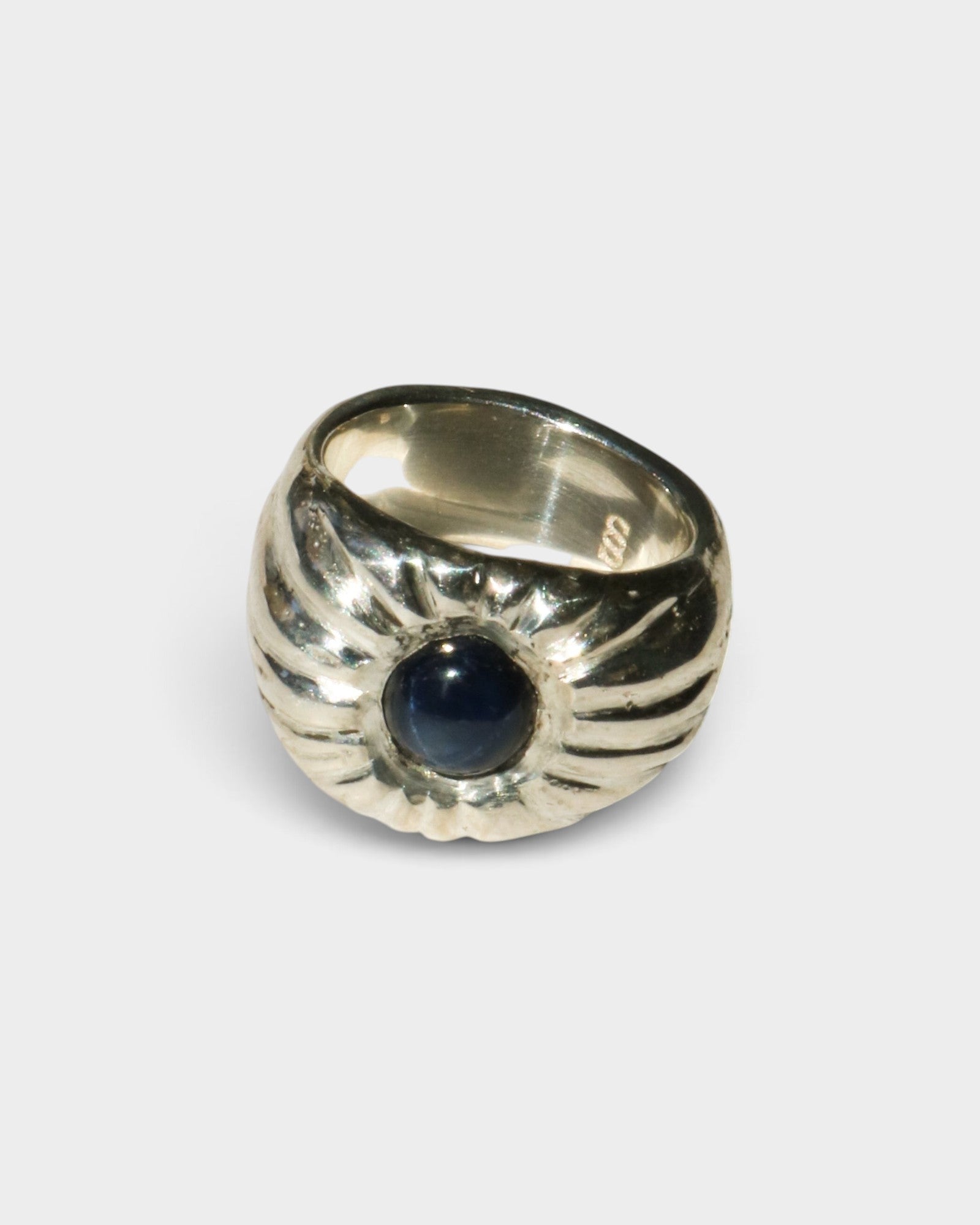 JONES + CO Dean ring in .925 sterling silver featuring a bold, sculptural design with a blue star sapphire center.