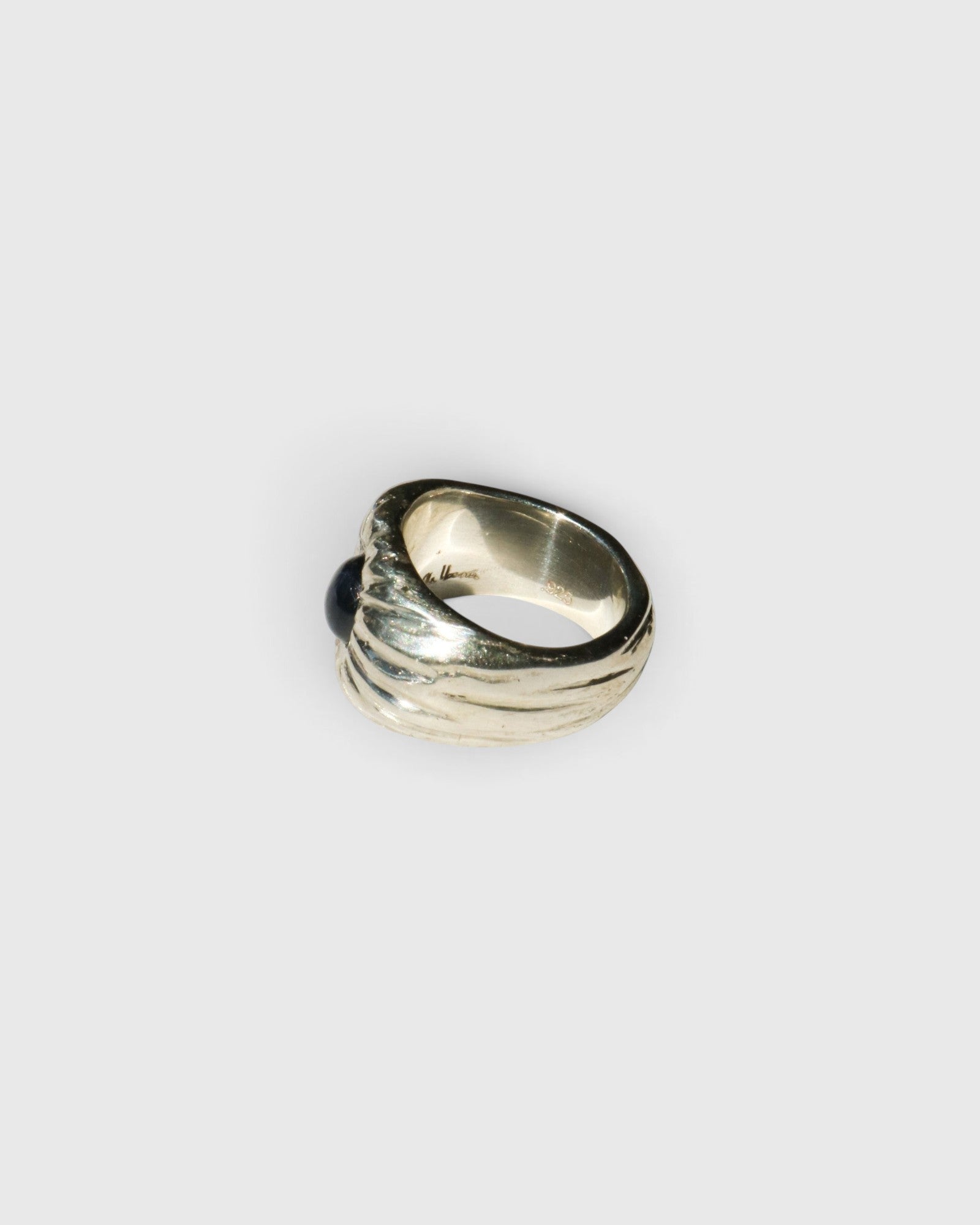 JONES + CO Dean sculptural sterling silver ring featuring a blue star sapphire gemstone