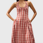JONES + CO Del Rose midi dress in terra rosso check cotton with halterneck, front tie, and A-line skirt.