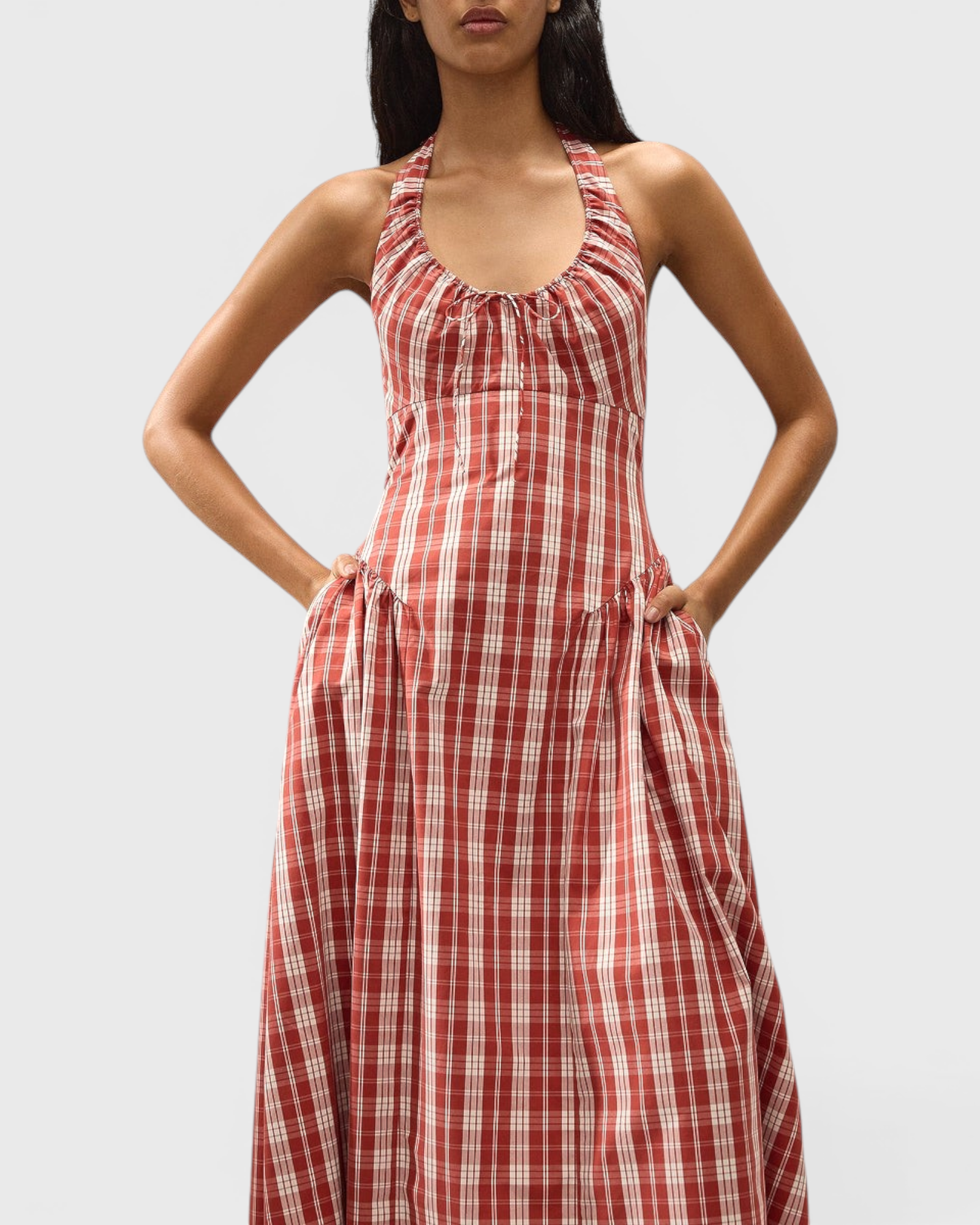 JONES + CO Del Rose midi dress in terra rosso check cotton with halterneck, front tie, and A-line skirt.