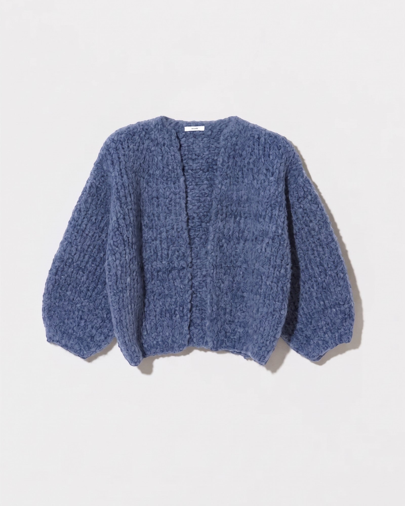 JONES + CO denim blue bomber cardigan in a soft, chunky knit alpaca and wool blend with a relaxed fit.