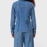 JONES + CO mid blue denim shirt with curved back seaming and long sleeves on a model