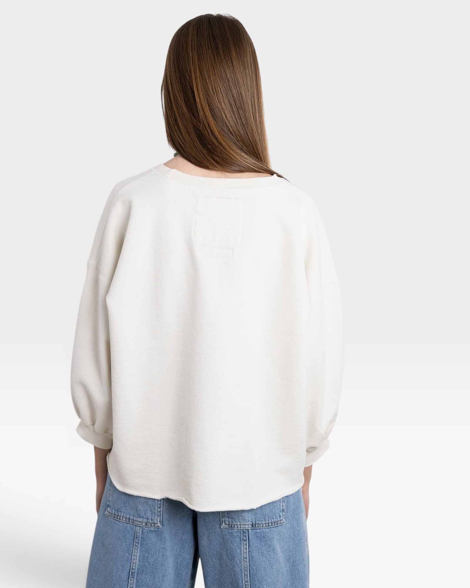 JONES + CO dirty white crewneck sweatshirt with drop shoulders, raw hem, and distressed detailing.