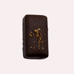 JONES + CO double chocolate truffle bar with a dark cacao shell, topped with crunchy cacao nibs and sea salt.