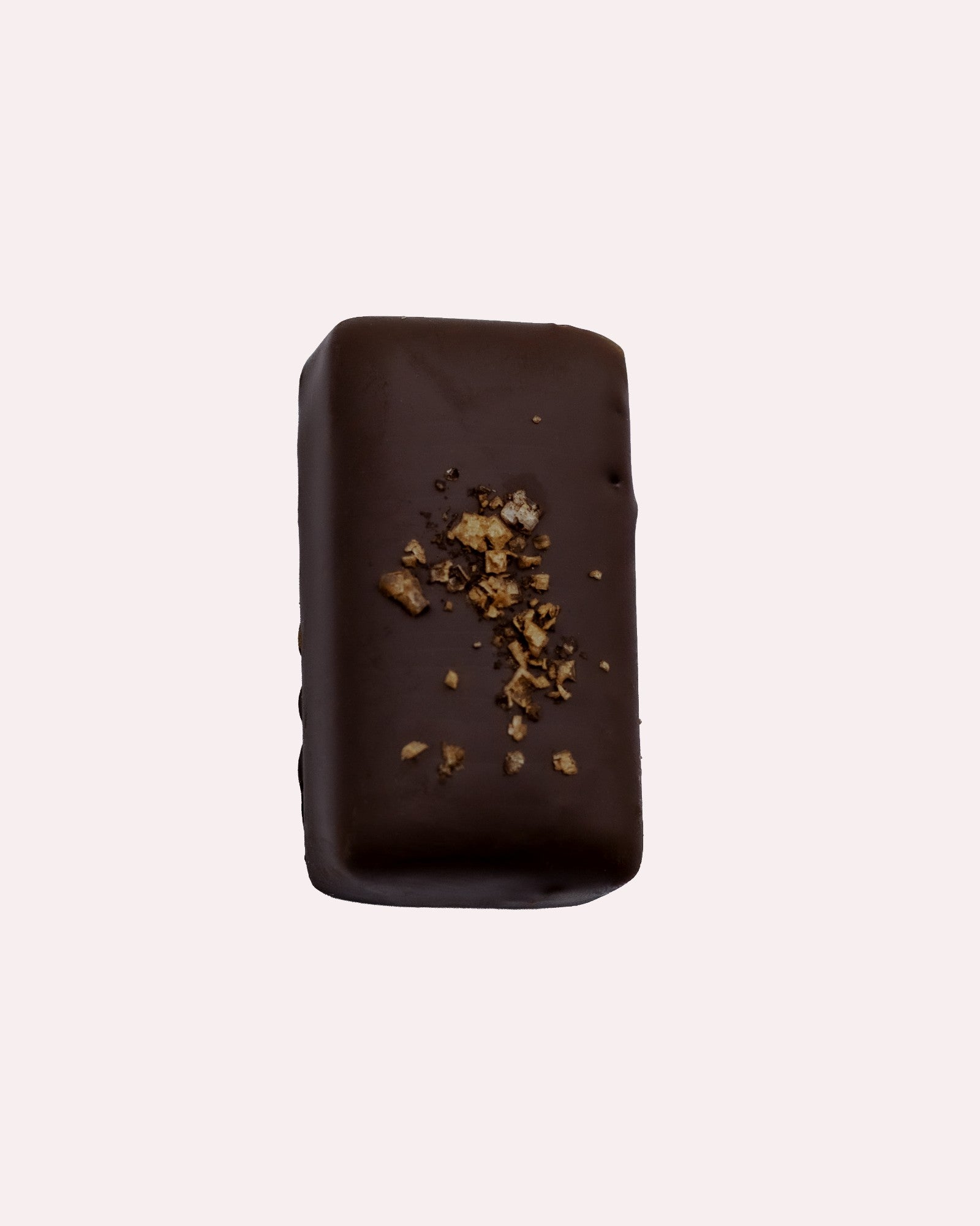 JONES + CO double chocolate truffle bar with a dark cacao shell, topped with crunchy cacao nibs and sea salt.