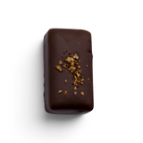 JONES + CO double chocolate truffle bar with a dark cacao shell, topped with crunchy cacao nibs and sea salt.