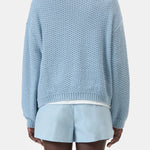 JONES + CO dove blue knitted jersey with 3D effect stripe pattern, made from organic cotton. Regular fit, long sleeves, ribbed cuffs.