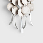 JONES + CO Dreamweaver wall hanging in Full Moon White featuring glazed stoneware discs and hemp rope accents.