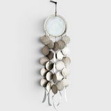 JONES + CO Dreamweaver wall hanging in Full Moon White, featuring stoneware and porcelain discs on hemp rope.