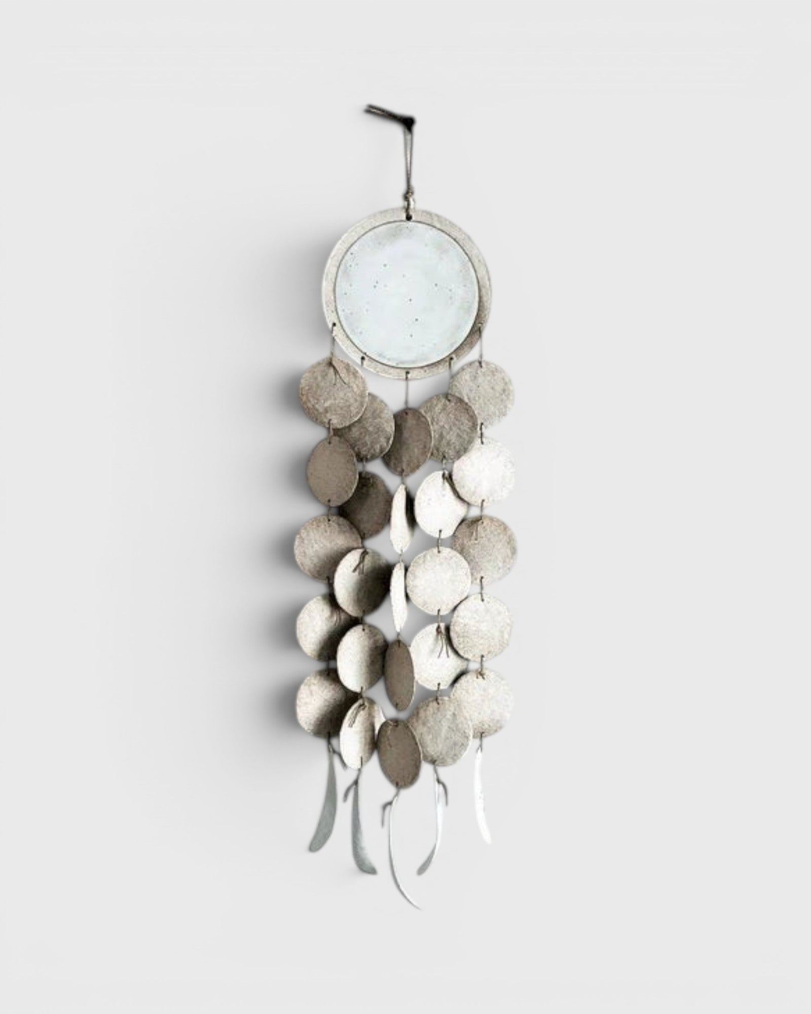 JONES + CO Dreamweaver wall hanging in Full Moon White, featuring stoneware and porcelain discs on hemp rope.